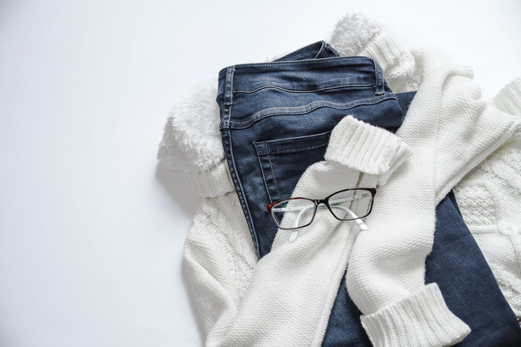 clothing laid out with glasses