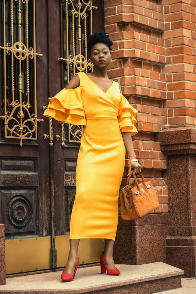 woman yellow dress with handbag